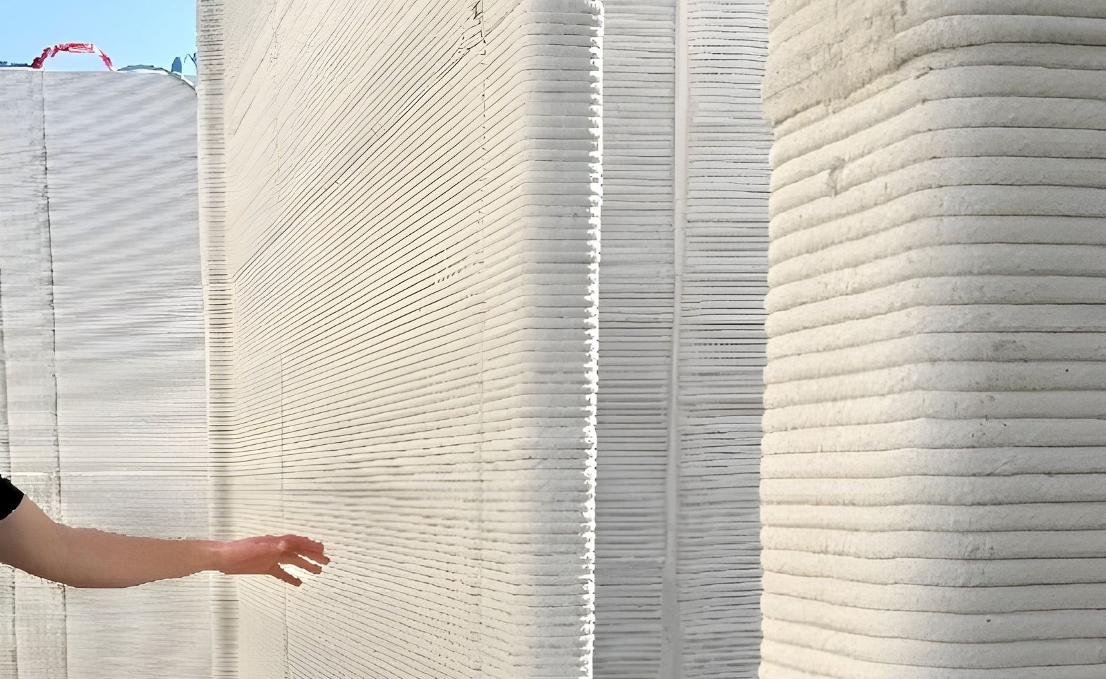 Freshly printed concrete walls with layered bead texture